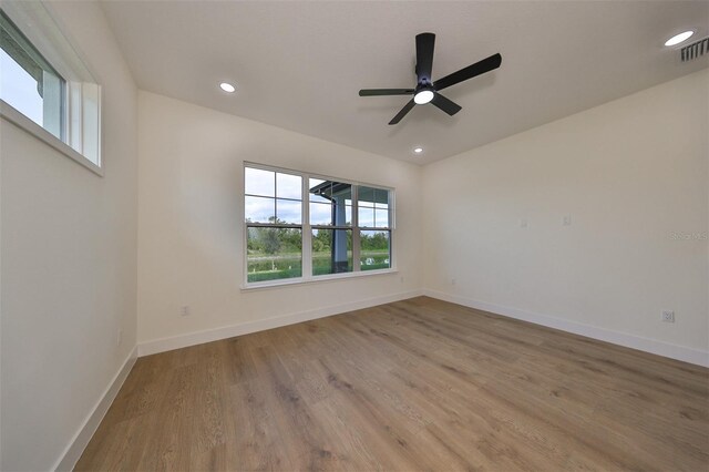 unfurnished room featuring light wood-type flooring and ceiling fan