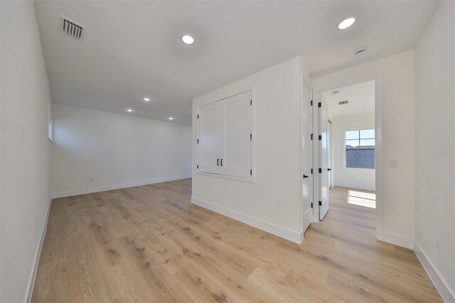 unfurnished room featuring light hardwood / wood-style flooring