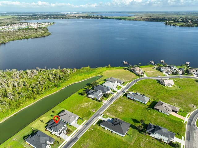 drone / aerial view with a water view