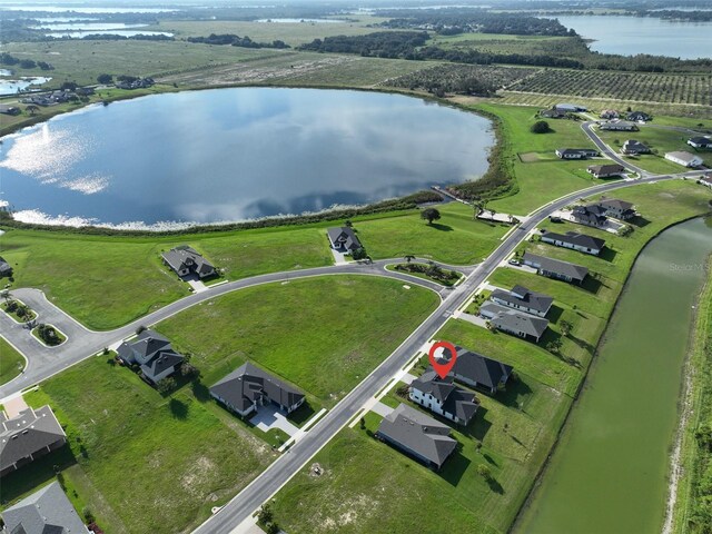 drone / aerial view featuring a rural view and a water view