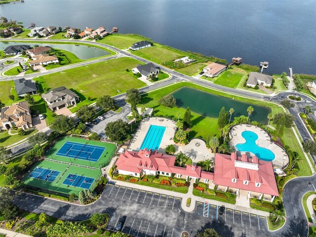 birds eye view of property with a water view