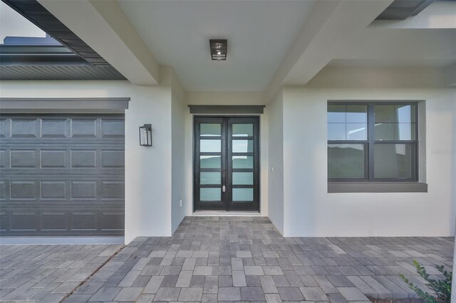 entrance to property featuring french doors