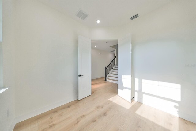 empty room with light wood-type flooring