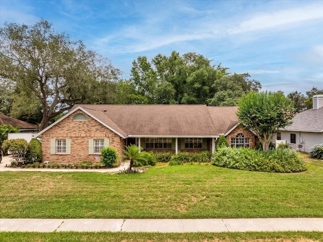 ranch-style home with a front yard