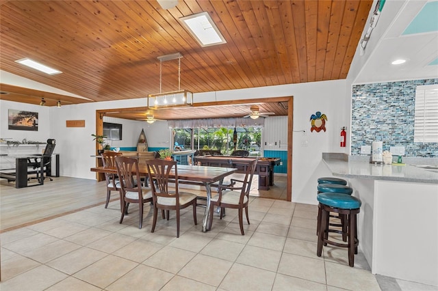 tiled dining space with lofted ceiling, ceiling fan, and wooden ceiling