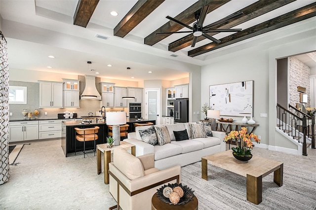 living room featuring recessed lighting, visible vents, baseboards, stairway, and beam ceiling