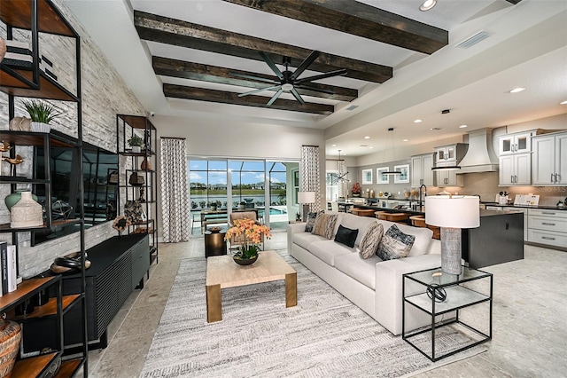 living room featuring ceiling fan, visible vents, beam ceiling, and recessed lighting