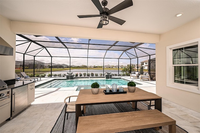 pool featuring outdoor dining area, area for grilling, a ceiling fan, glass enclosure, and a patio area