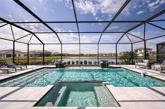 view of pool with a patio area, glass enclosure, an in ground hot tub, and pool water feature