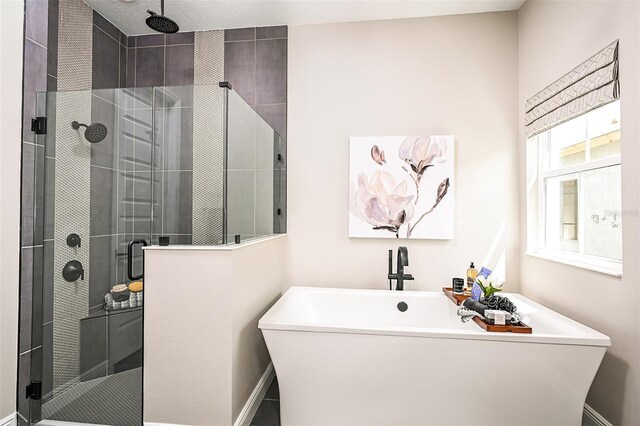 bathroom with tiled shower