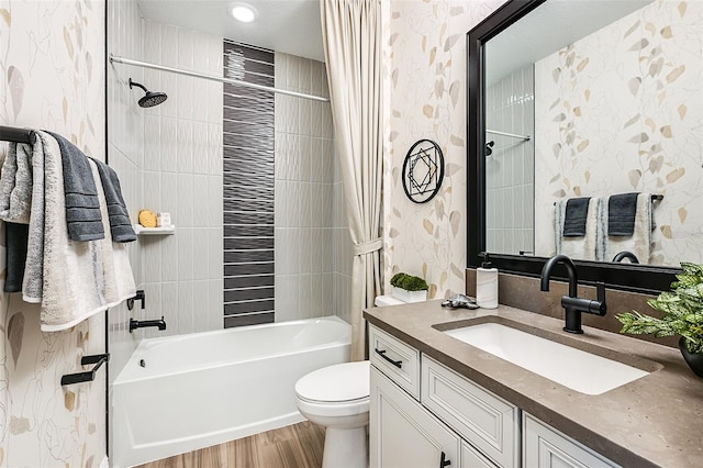 full bathroom with toilet, wood-type flooring, vanity, and shower / bath combo