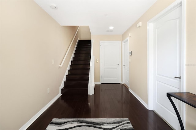 staircase featuring hardwood / wood-style flooring