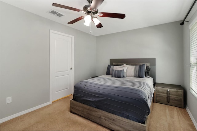 bedroom with light carpet and ceiling fan