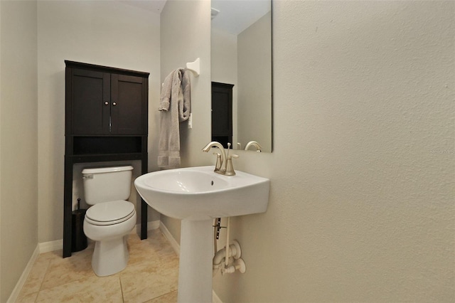 bathroom featuring tile patterned floors and toilet