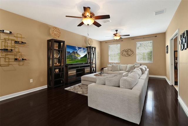 living room featuring dark hardwood / wood-style floors and ceiling fan