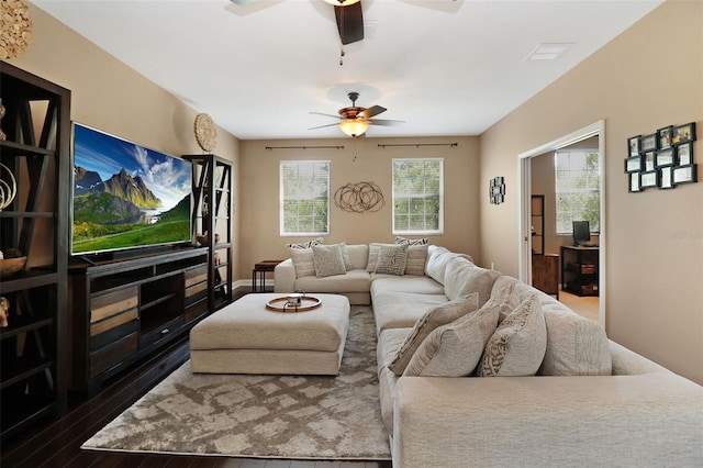 living room with ceiling fan and wood-type flooring