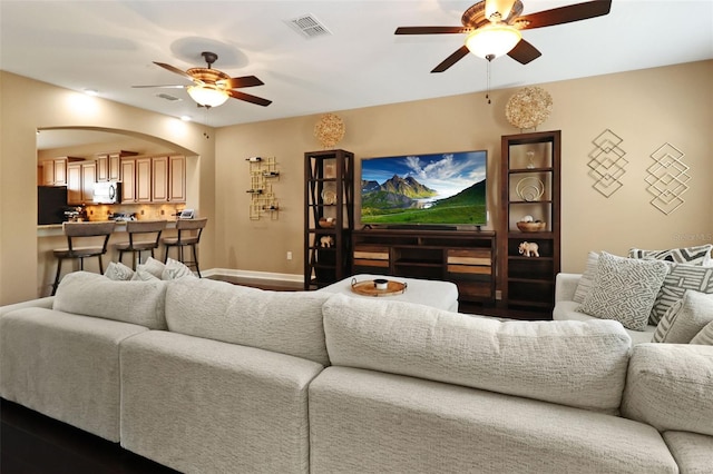 living room featuring ceiling fan