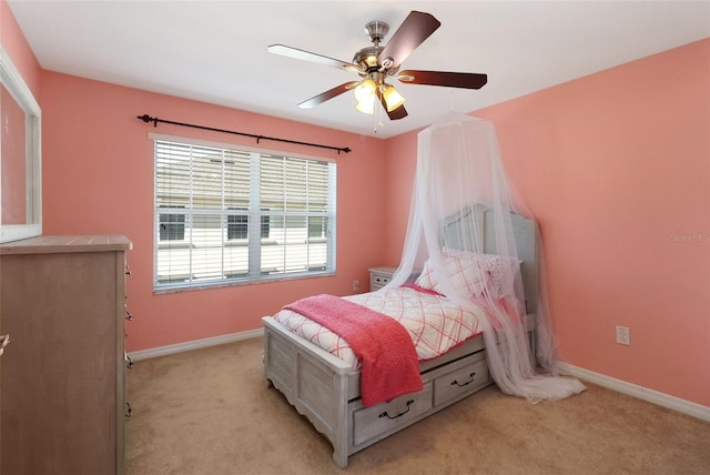 bedroom with ceiling fan and light colored carpet