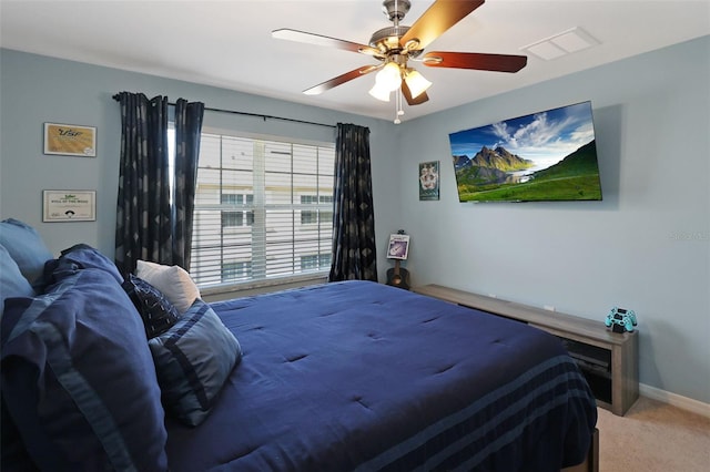 bedroom with ceiling fan and carpet floors