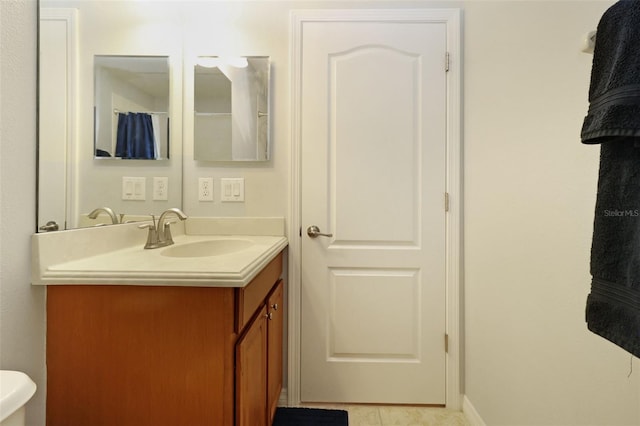 bathroom featuring tile patterned floors and vanity