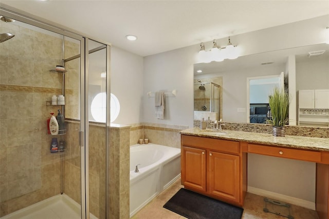 bathroom with plus walk in shower, vanity, and tile patterned flooring