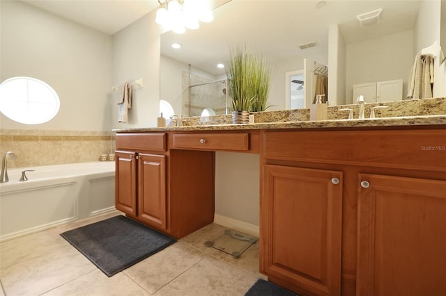 bathroom featuring tile patterned floors, vanity, and separate shower and tub