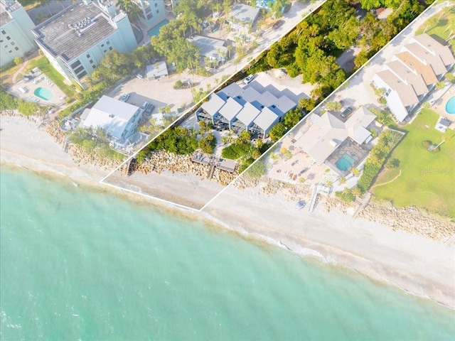 aerial view featuring a water view and a view of the beach