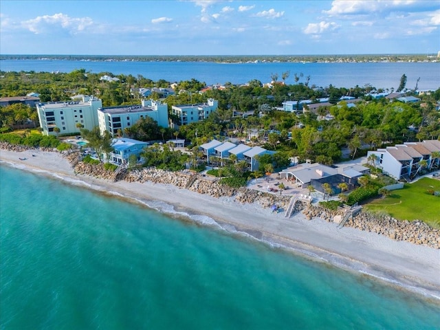 bird's eye view featuring a water view and a view of the beach