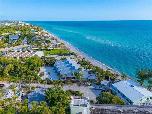 drone / aerial view with a beach view and a water view