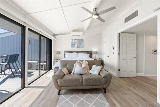 bedroom featuring a wall mounted AC, ceiling fan, access to exterior, light hardwood / wood-style flooring, and lofted ceiling