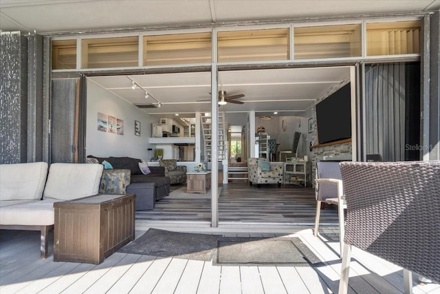 wooden deck with outdoor lounge area