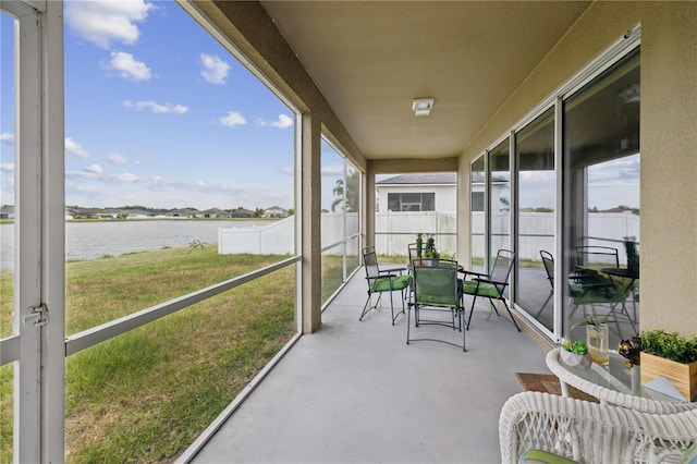 sunroom with a water view