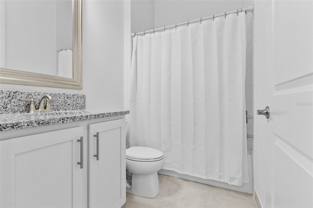 full bathroom featuring tile patterned flooring, shower / tub combo, vanity, and toilet