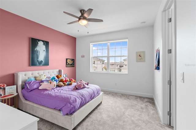 bedroom with ceiling fan and light colored carpet