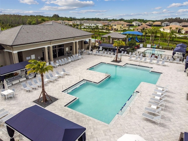 view of swimming pool with a patio