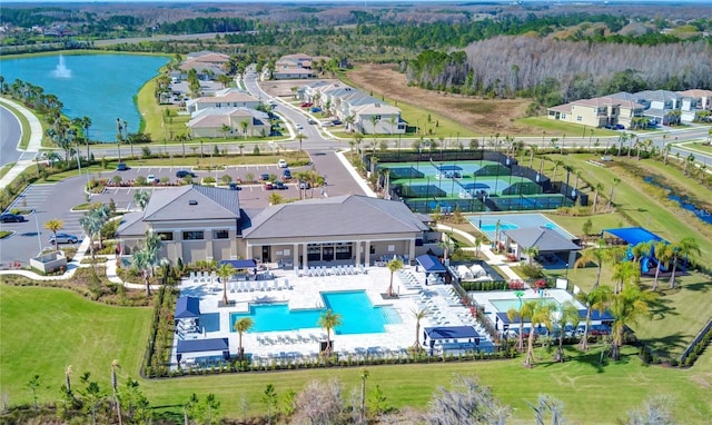 birds eye view of property with a water view