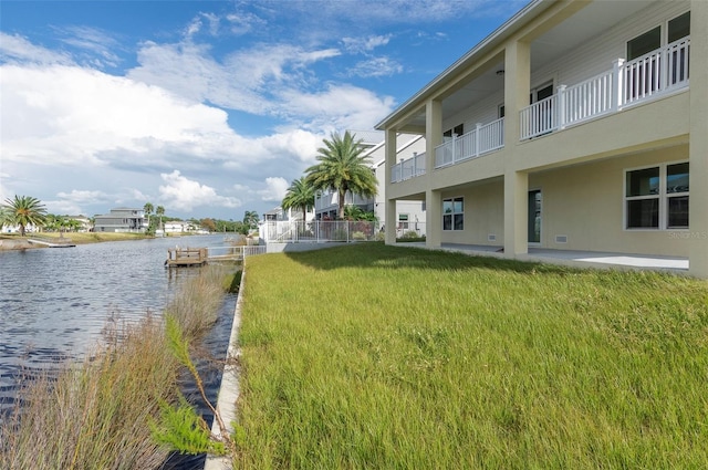 3431 Sheephead Dr, Hernando Beach, FL 34607 - dock area featuring a water view and a lawn