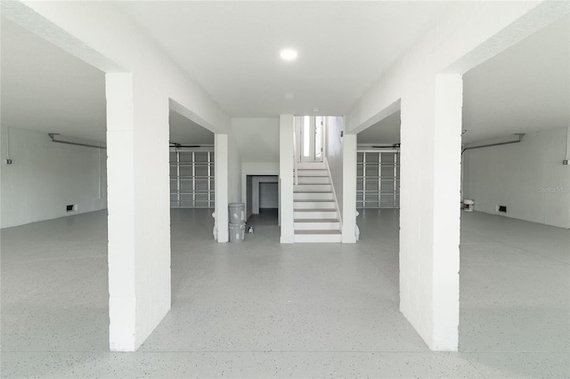 3431 Sheephead Dr, Hernando Beach, FL 34607 - corridor with stairs, speckle patterned floor, and recessed lighting