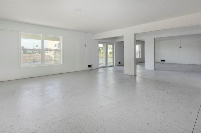 3431 Sheephead Dr, Hernando Beach, FL 34607 - empty room featuring speckle patterned floor