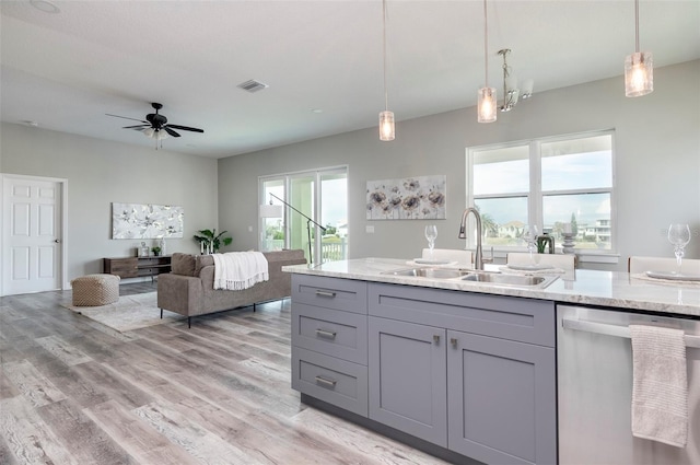 3431 Sheephead Dr, Hernando Beach, FL 34607 - kitchen featuring dishwasher, a sink, gray cabinets, a ceiling fan, and light wood finished floors