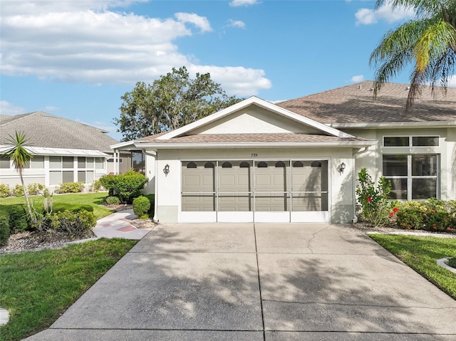 single story home with a garage and a front yard