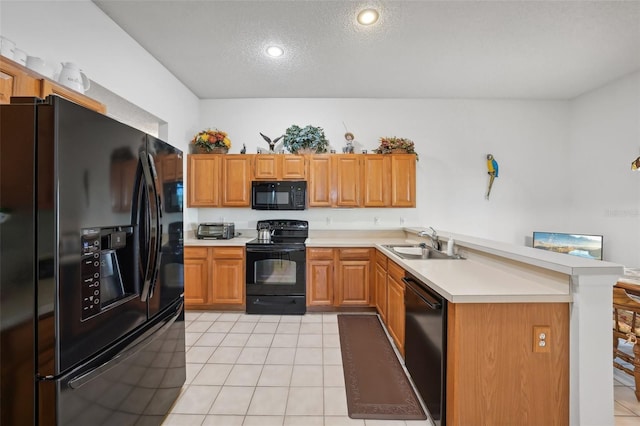 kitchen featuring black appliances, sink, a textured ceiling, light tile patterned flooring, and kitchen peninsula