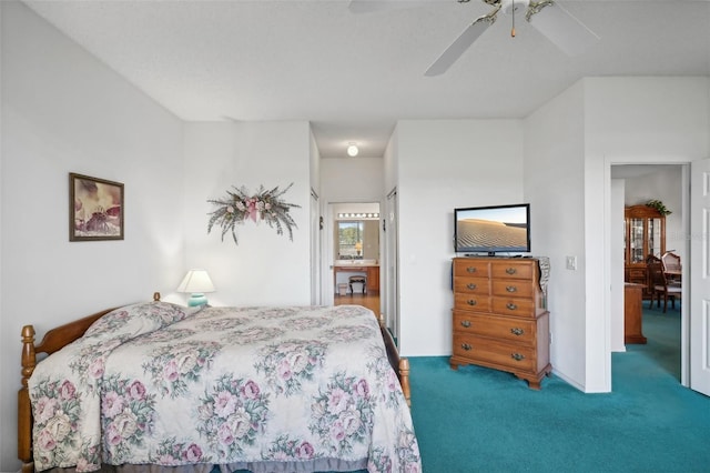 bedroom with ceiling fan and carpet floors