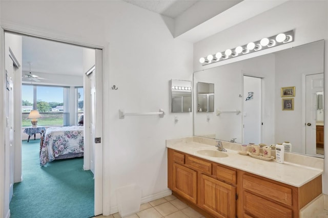 bathroom with tile patterned floors, ceiling fan, and vanity