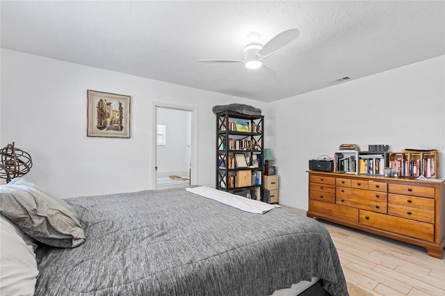 bedroom with hardwood / wood-style floors and ceiling fan