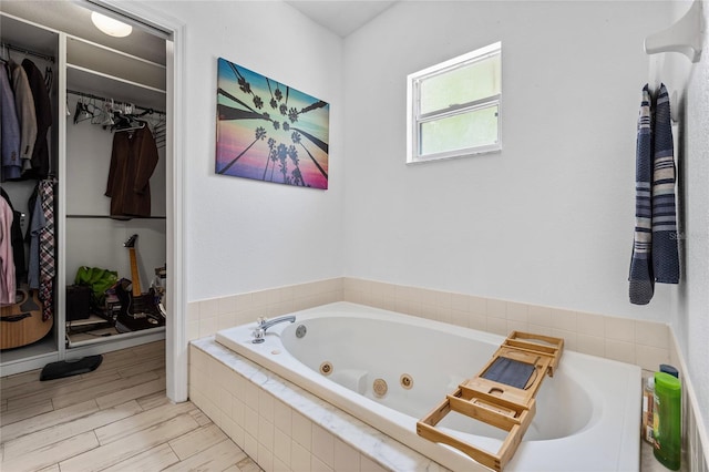 bathroom featuring tiled bath