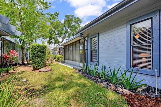 view of yard featuring a sunroom