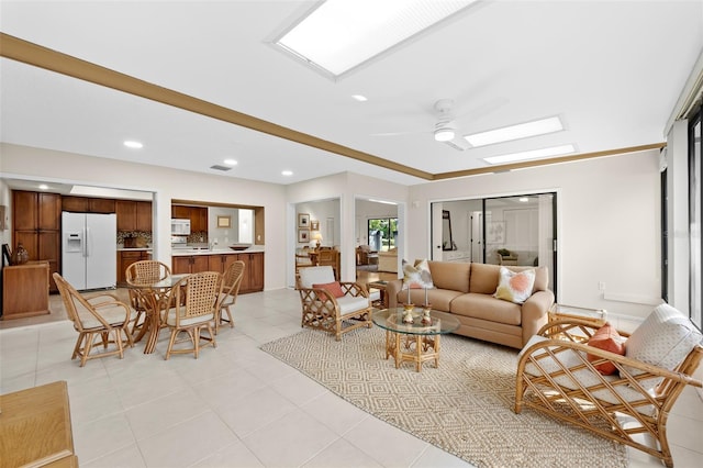 tiled living room with ceiling fan