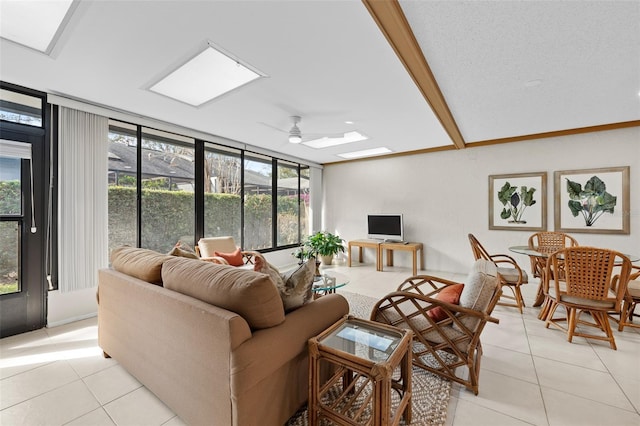 tiled living room featuring a textured ceiling and ceiling fan