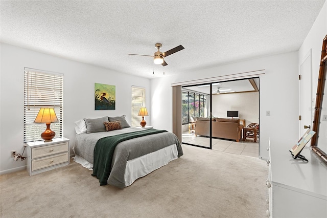 carpeted bedroom featuring a textured ceiling, access to outside, and ceiling fan